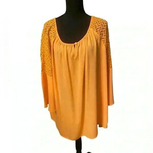 Cato blouse in orange has rounded neck lace on shoulder & part of sleeve 22/24W